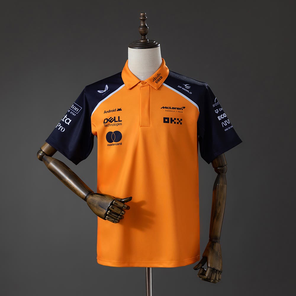 Polo McLaren Racing 2025 F1 Naranja y Azul Marino - Vista frontal